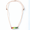 Necklace with a colorful rectangular pendant on a white background