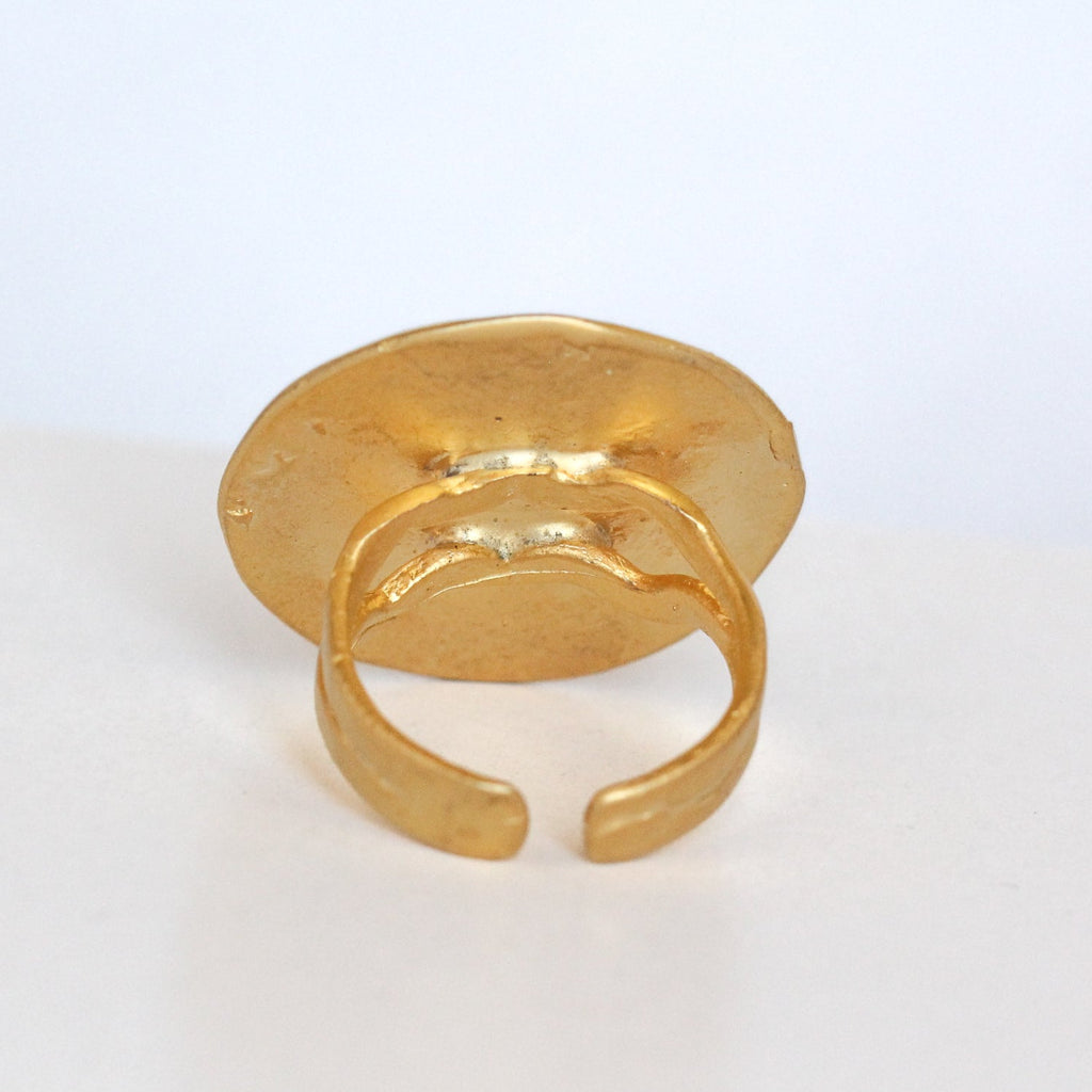 Gold ring on a white background